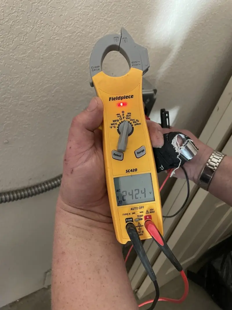 Voltage testing with clamp meter during Generator Installation in Plympton